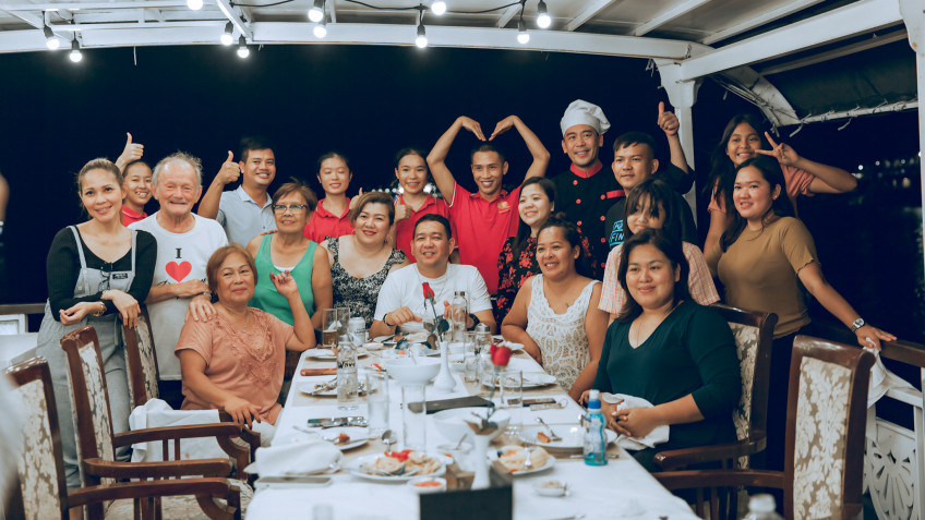 Oriental Sails: Family Members Enjoy Dinner Party